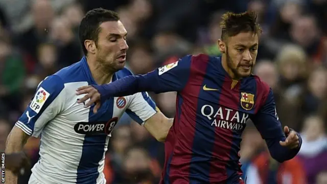 Neymar (right) vies with Espanyol's defender Anaitz Arbilla