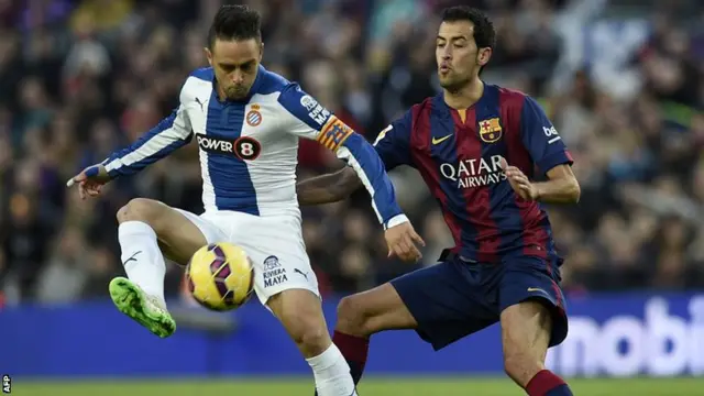 Sergio Busquets challenging for the ball