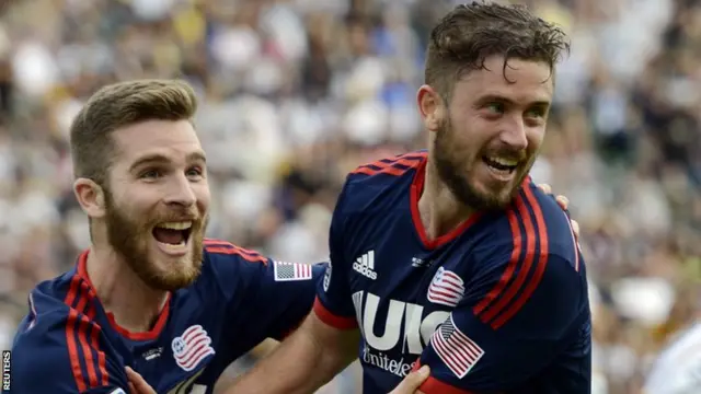 New England Revolution player Chris Tierney (right) celebrates with teammate Patrick Mullins