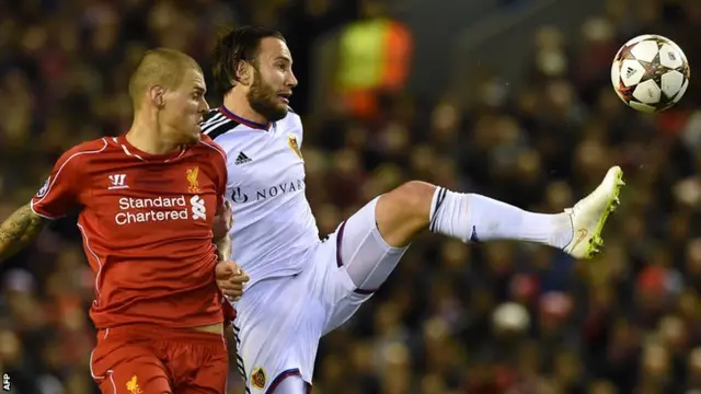 Basel's Shkelzen Gashi takes on Martin Skrtel