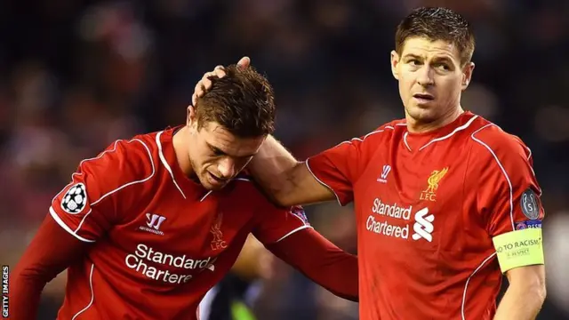 Liverpool captain Steven Gerrard consoles Jordan Henderson