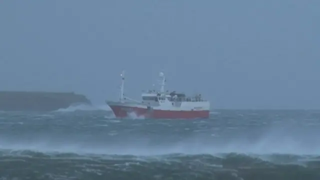 A boat battles through the waves off the Isle of Lewis