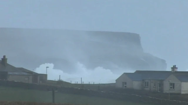 Towering waves crashed onto the cliffs in Orkney