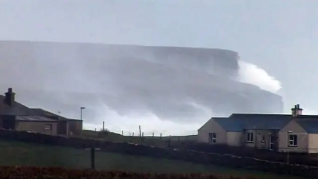 Waves crash on Orkney