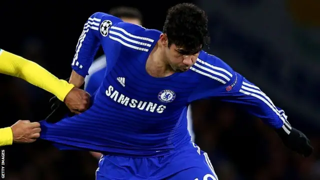 Chelsea striker Diego Costa has his shirt pulled