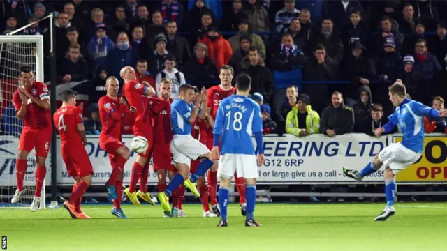 Kevin Holt fires in the opening goal with a cracking free-kick midway through the first half