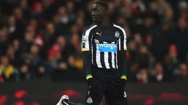 Papiss Demba Cisse on his knees