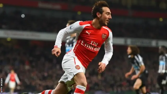 Santi Cazorla celebrates