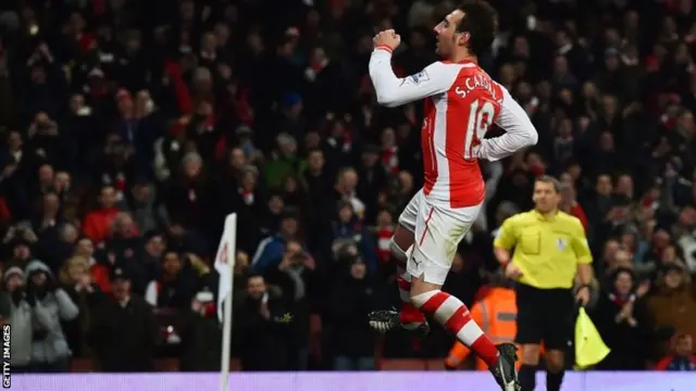 Santi Cazorla celebrates