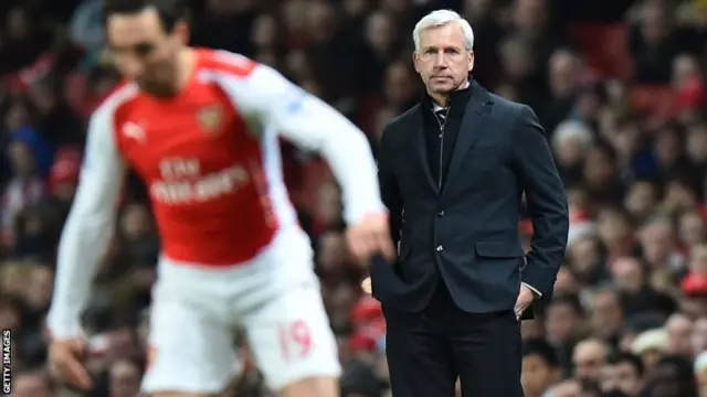 Alan Pardew watches on