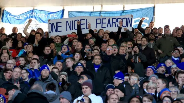 Leicester City fans watch their team against Manchester City