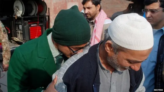 A student cries on a man"s shoulder, after he was rescued from the Army Public School that in under attack by Taliban gunmen in Peshawar, December 16, 2014