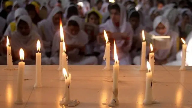 Pakistani school children in Hyderabad pray for those killed in the school attack in Peshawar - 17 December 2014