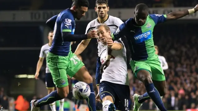 Harry Kane battles for possession