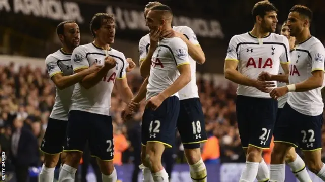 Nabil Bentaleb celebrates with teammate