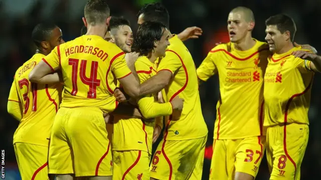 Lazar Markovic celebrates with teammates