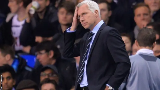 Alan Pardew looks on