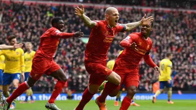 Martin Skrtel celebrates scoring against Arsenal