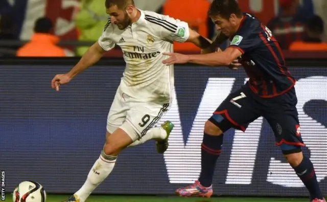 Karim Benzema runs with the ball