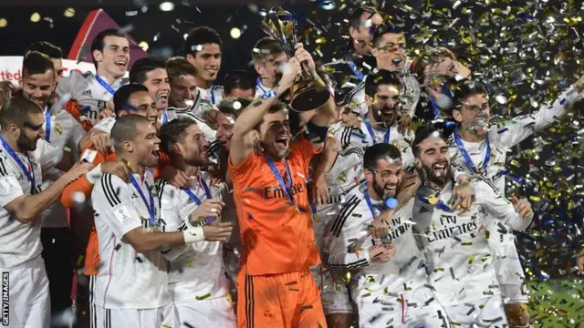 Real Madrid celebrate with the trophy