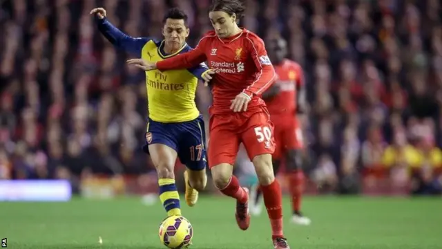 Lazar Markovic (right) and Alexis Sanchez battle for the ball