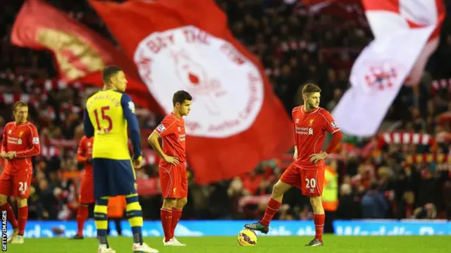 Adam Lallana prepares to kick-off