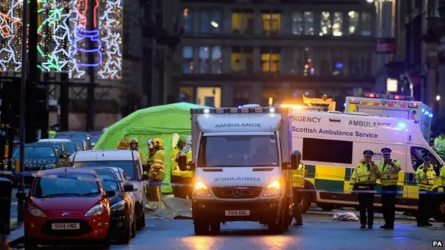 Emergency services attend the scene of the crash in George Square