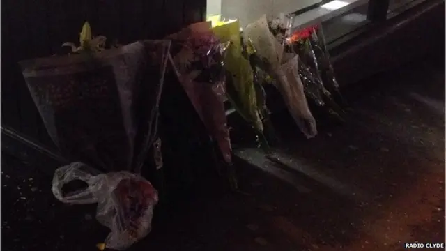 Floral tributes laid at Glasgow crash site