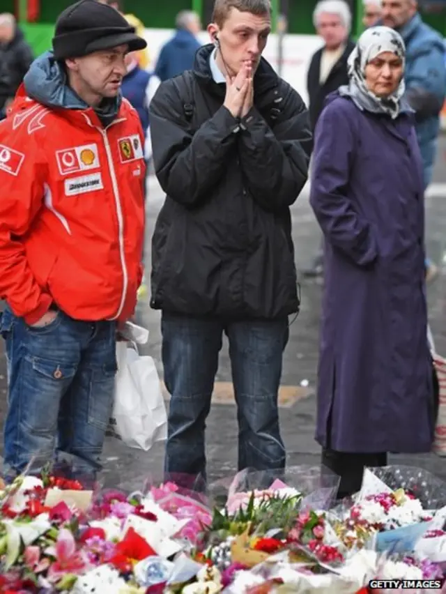 People pay tribute at George Square