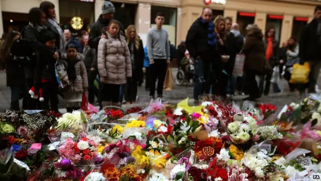 People pay tribute at George Square