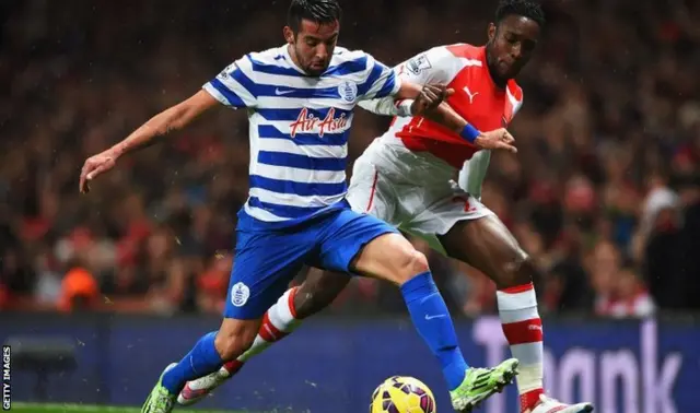 Mauricio Isla tackles Danny Welbeck