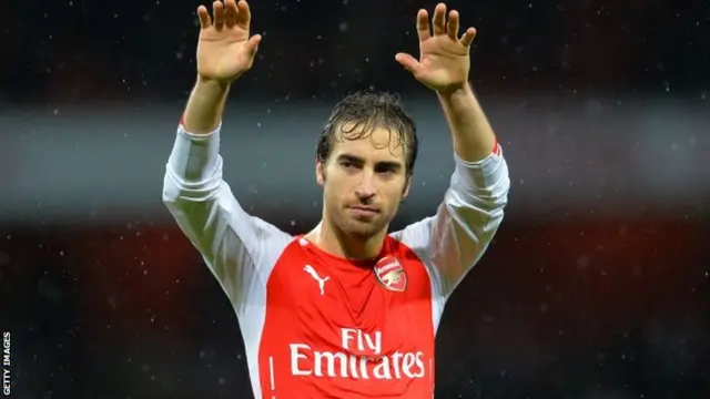 Mathieu Flamini salutes the fans at full-time