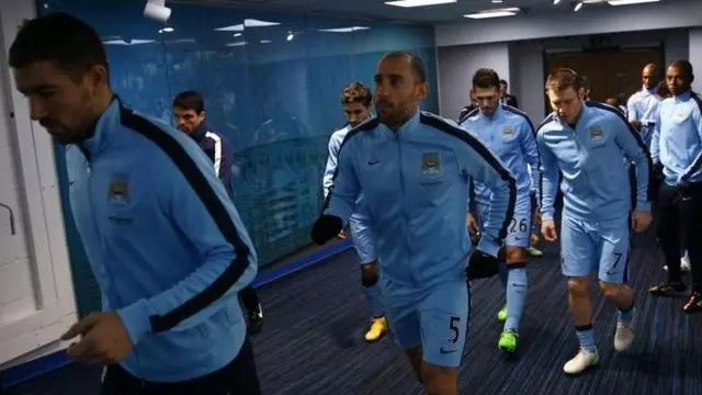 A few last-minute stretches in the tunnel before pre-match drills begin for the lads.