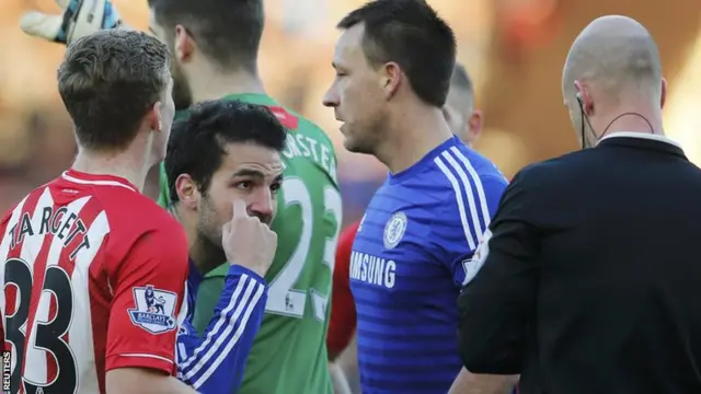 Cesc Fabregas is booked