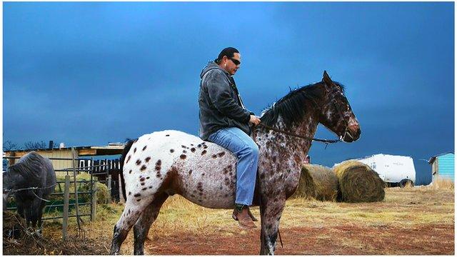 Shane Red Hawk on horseback