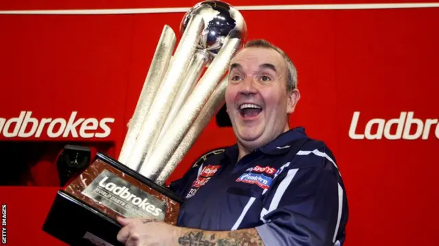 Phil Taylor with the Sid Waddell Trophy