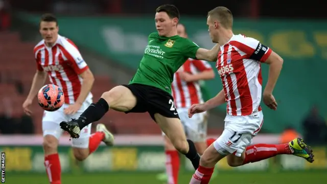 Ryan Shawcross challenges for the ball