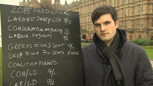 Alex Donohue from Ladbrokes with election odds written on a chalk board