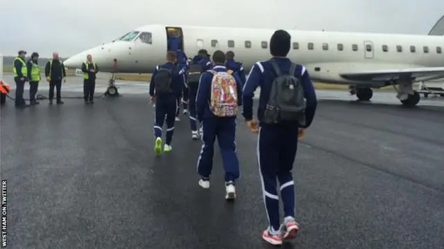 West Ham players board a plane to travel to Liverpool for a game at Everton