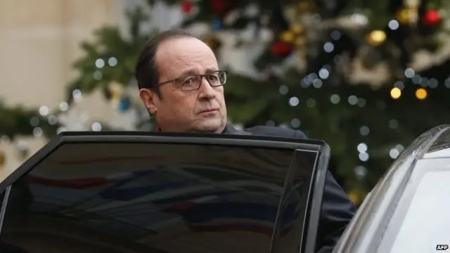 French President Francois Hollande leaves the Elysee Palace