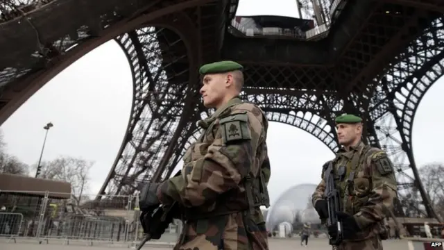 Soldiers at the Eiffel tower following the attack on Charlie Hebdo