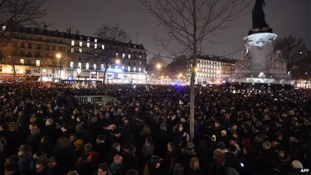 People gather at the Place de la Republique (Republic square) in Paris, on January 7, 2015, following an attack by unknown gunmen on the offices of the satirical weekly, Charlie Hebdo.