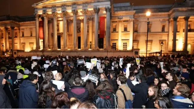 People take part in a vigil in Trafalgar Square, London, after three gunmen carried out a deadly terror attack on French satirical magazine Charlie Hebdo in Paris, killing 12 people. PRESS ASSOCIATION Photo. Picture date: Wednesday January 7, 2015