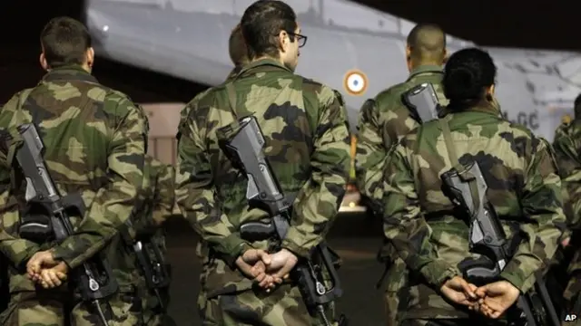 French soldiers disembark at Le Bourget airport, north of Paris, as part of deployment of soldiers to enhance security in Paris, Wednesday, Jan. 7, 2015. Thr