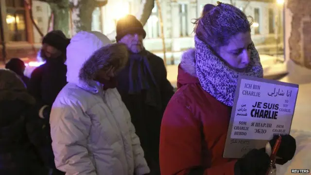 People wait in line to pay their respects during a vigil, for the victims of a shooting by gunmen at the offices of weekly satirical magazine Charlie Hebdo in Paris, during a vigil at the French consulate in Quebec City, January 7, 2015