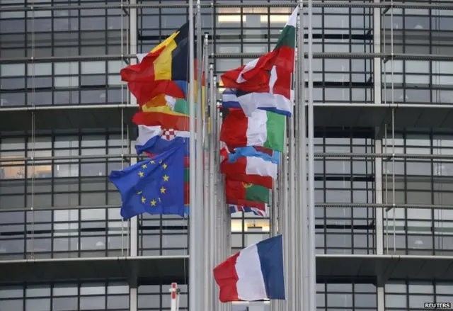 Flags fly at half mast outside the European Parliament