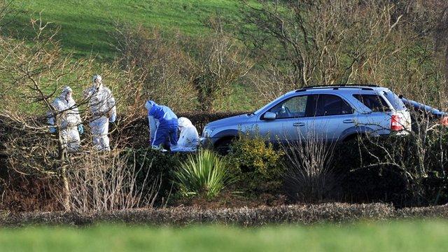 Forensic investigators at the scene of the murder