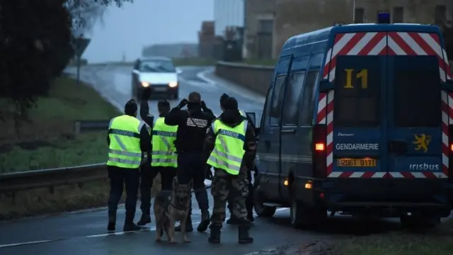 Police officers at a check point outside Longpont, France. Photo: 9 January 2015