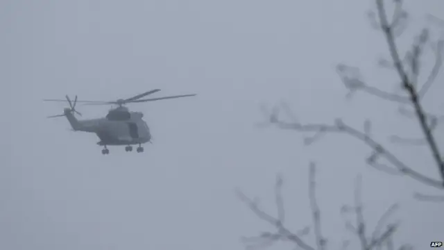 A helicopter flies over Dammartin-en-Goele. Photo: 9 January 2015