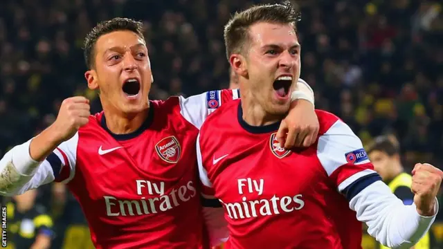 Arsenal midfielders Mesut Ozil (left) and Aaron Ramsey